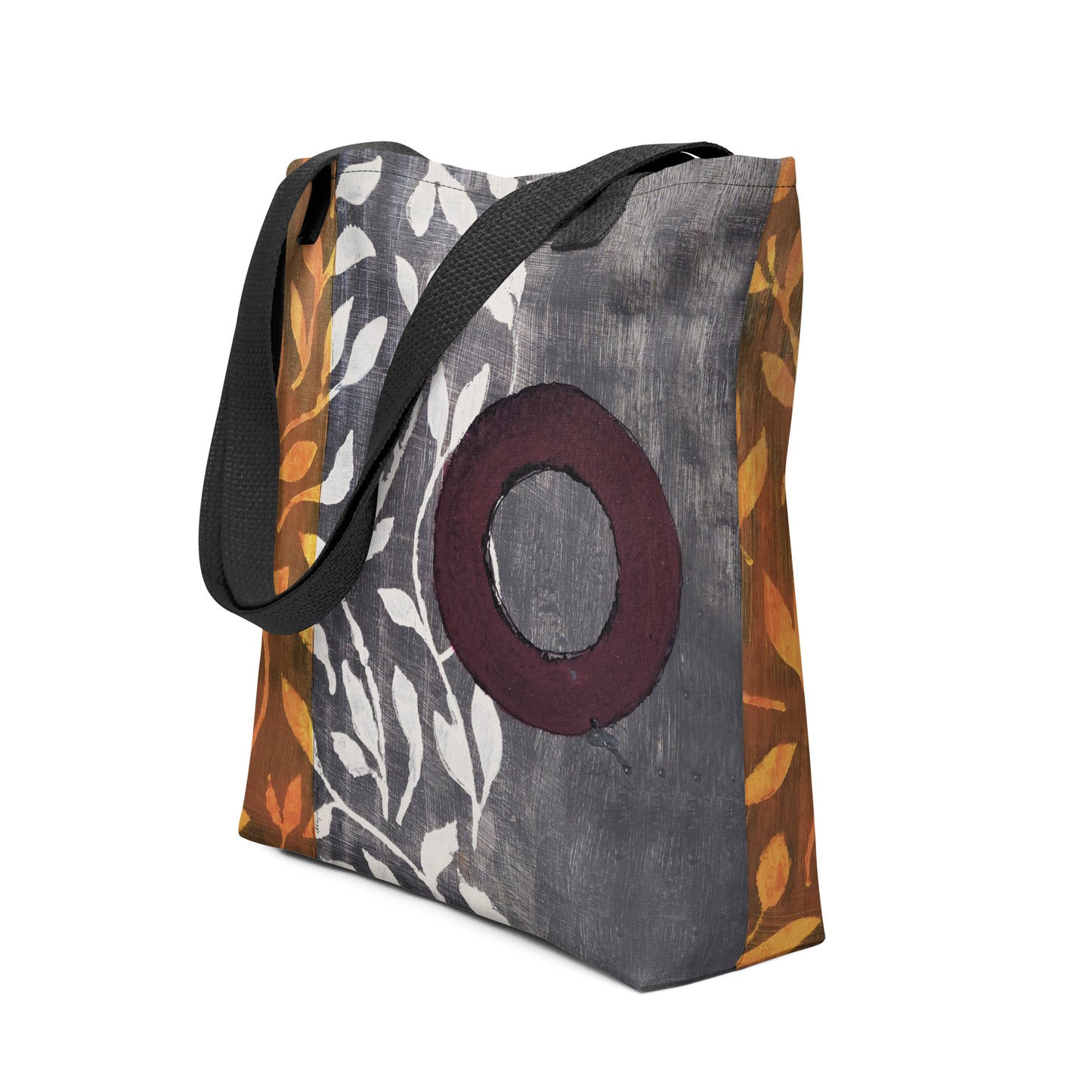 Tote bag of original art. Plum circle on gray and light burnt orange background with off-white leaf design.