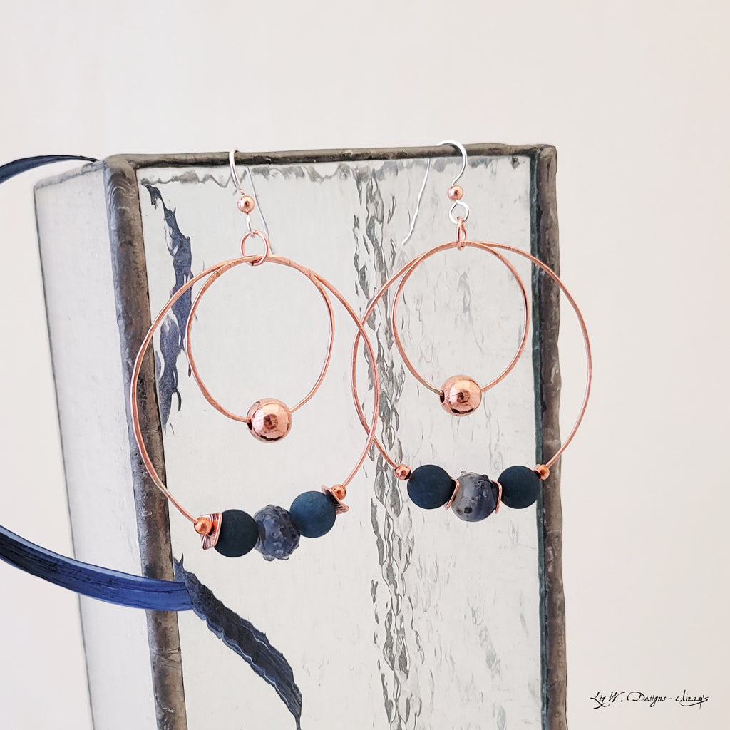 Handmade earrings large copper circles that are lightweight, featuring copper beads, agate and glass beads, dark blue tones