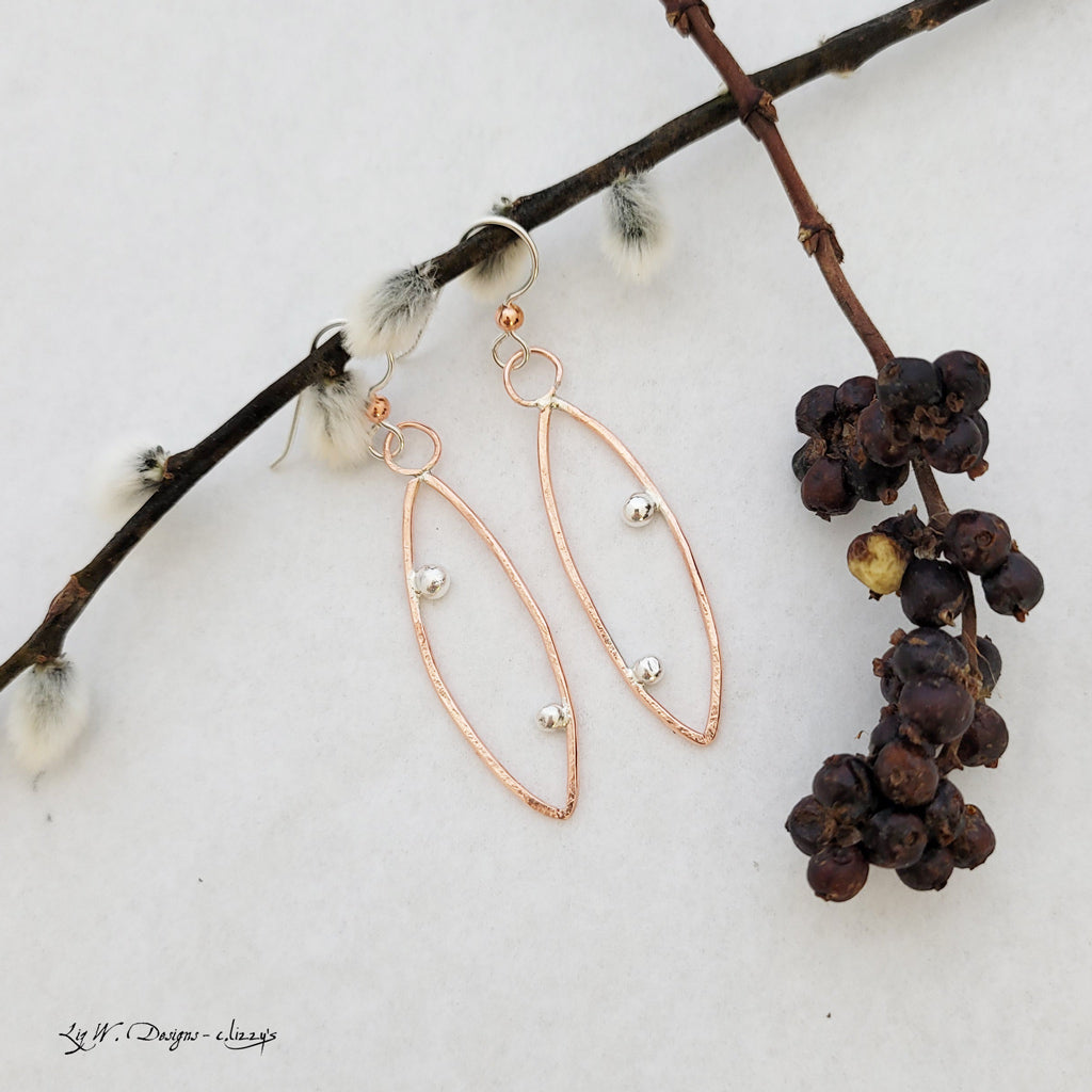 Handmade earrings of copper modern leaf shape with sterling silver dew drops