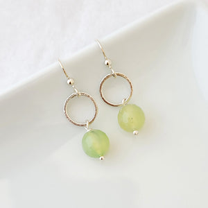 Hand-formed earrings with sterling silver circles connected to light green faceted agate drops