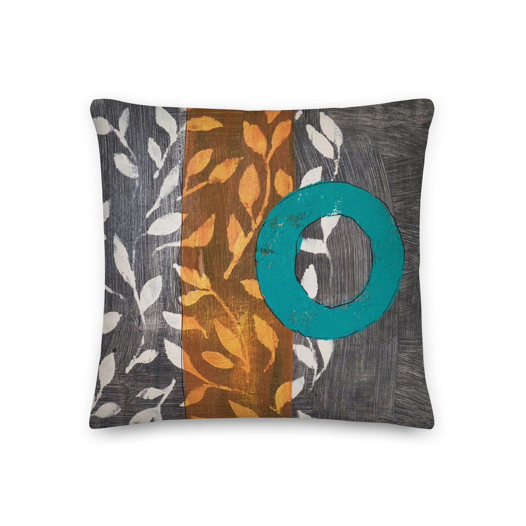 Pillow of original art. Turquoise circle on gray and light burnt orange background with off-white leaf design.