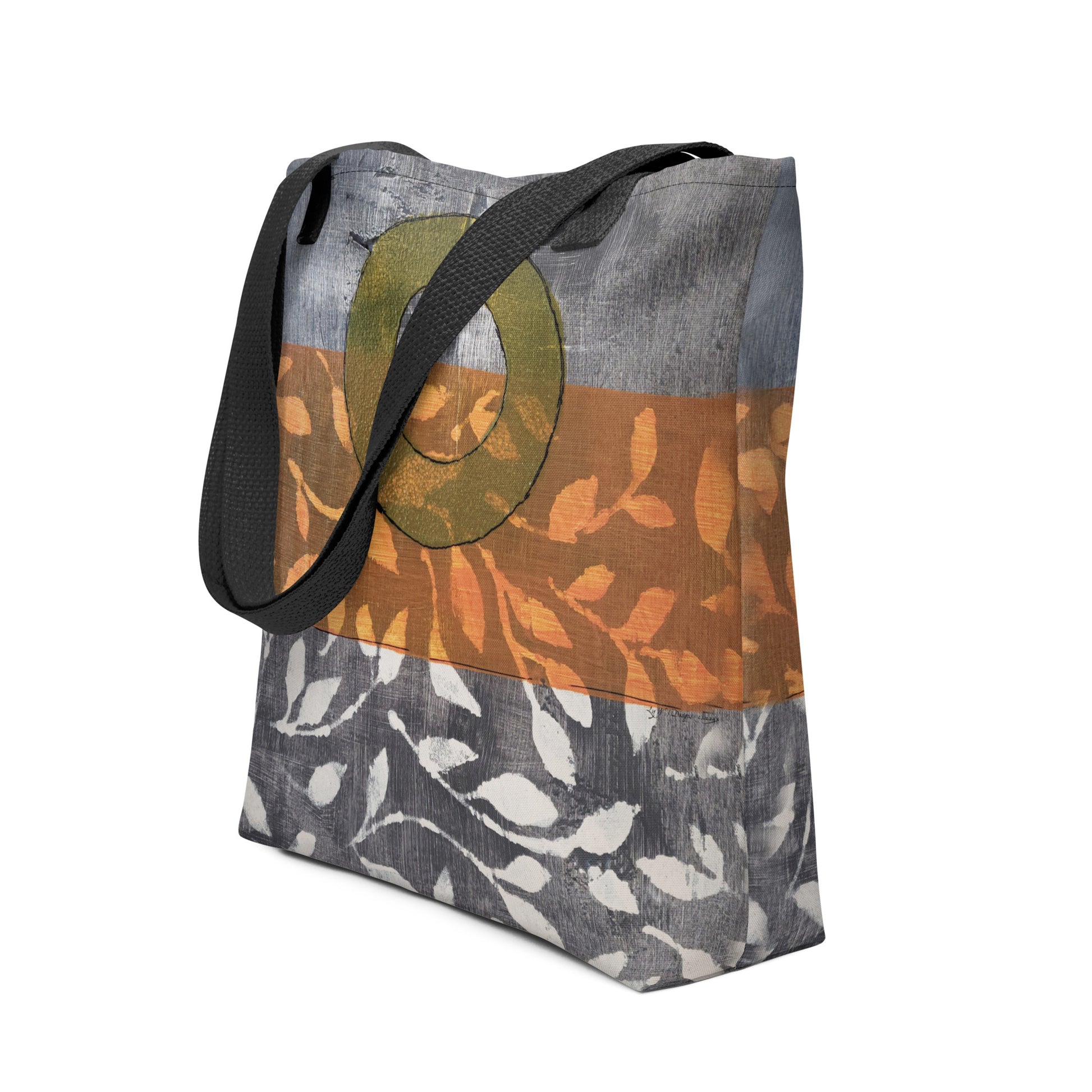 Tote bag of original art.  Avocado green circle on gray and light burnt orange background with off-white leaf design.